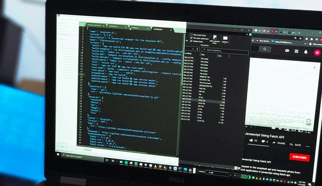 A web developer's workspace with code, clipboard, and an image preview on a laptop—illustrating online conversion from Base64 to image
