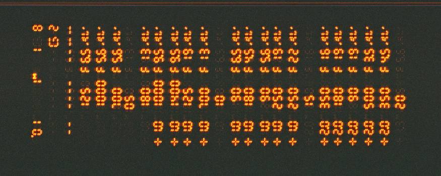 A close-up of a computer screen displaying binary code, symbolizing digital encoding and data conversion