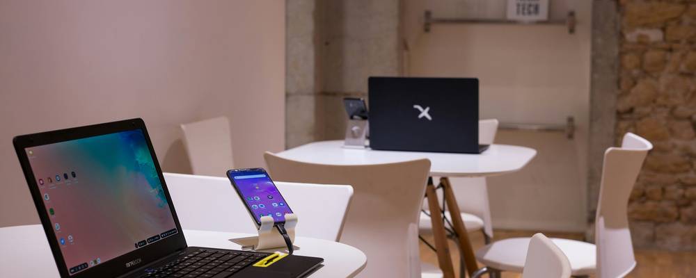A modern workspace with a laptop, notepad, and code editor—illustrating digital text editing and coding in action