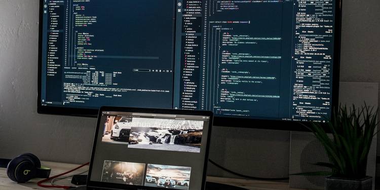 Modern developer working in a secure code environment, with screens showing code and digital security icons
