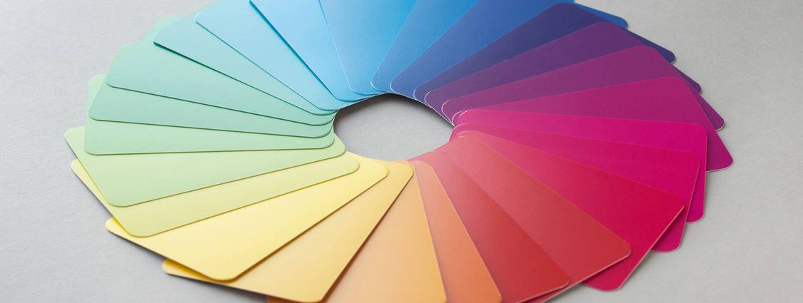 A designer using a color palette tool to select web-safe colors