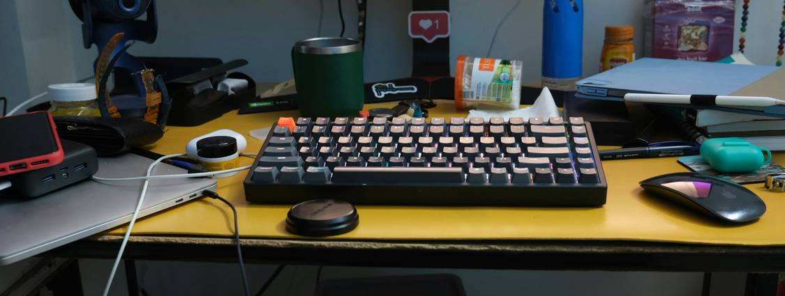A creative workspace with vibrant color swatches and a computer showing color picker and contrast checking