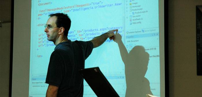 A programmer formatting JSON data on a laptop screen