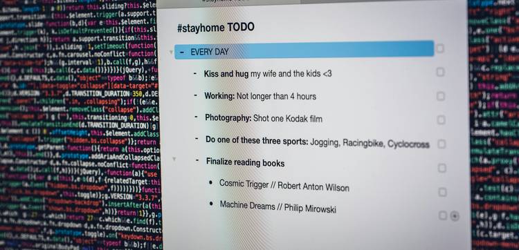 A close-up of a laptop screen showing markdown syntax and HTML code side-by-side, representing technical documentation and web publishing workflow