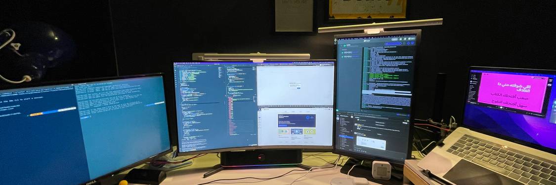 A developer's desk with code on screen and a digital lock overlay, representing secure web development in action