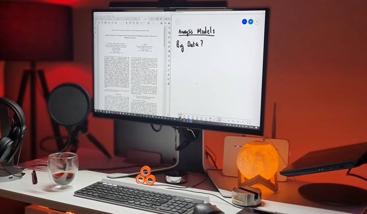 A tidy desk with a computer displaying clean, formatted text, signifying the text cleaning process