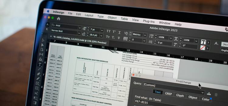 A modern workspace with multiple people editing documents on laptops, illustrating collaboration and version control in text editing